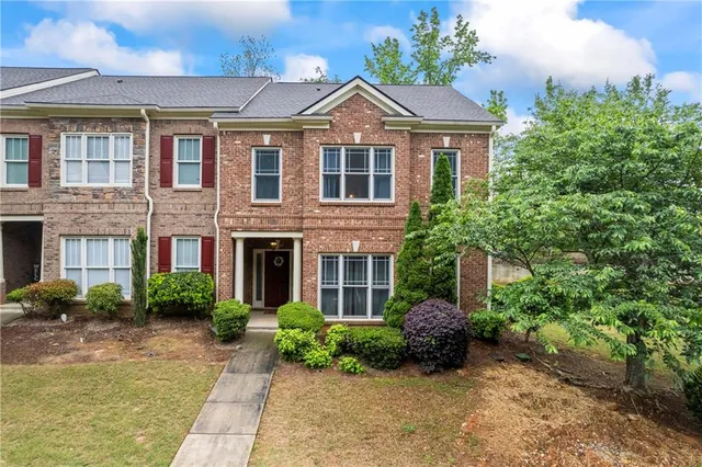 a front view of a house with garden