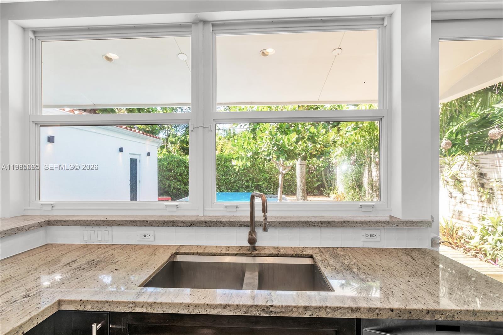 776 Northeast 74th Street Miami, FL 33138 - Photo 12 of 40 a view closed a sink and a window