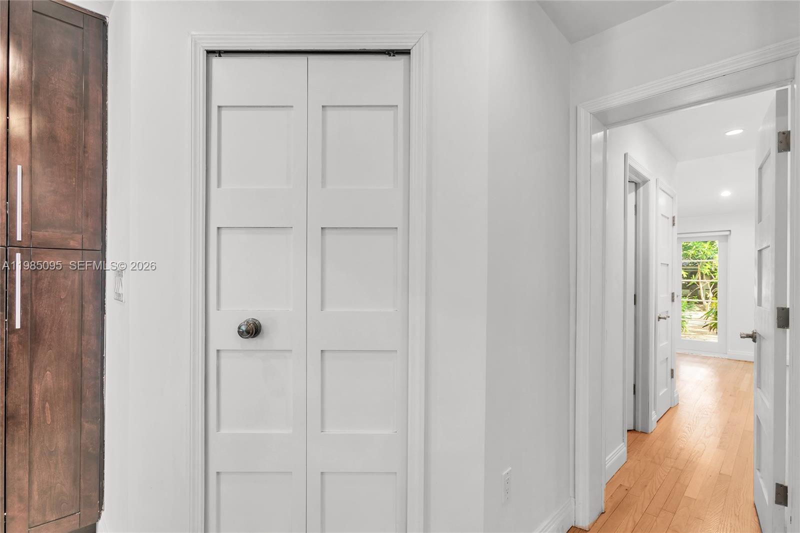 776 Northeast 74th Street Miami, FL 33138 - Photo 14 of 40 a view of a hallway with wooden floor