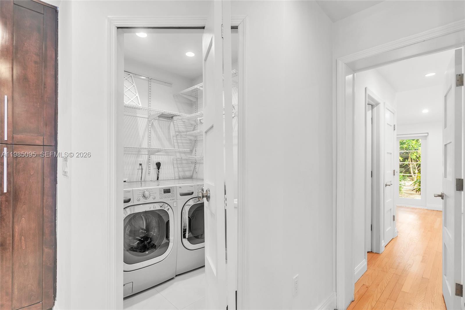 776 Northeast 74th Street Miami, FL 33138 - Photo 15 of 40 a view of a hallway with washer and dryer