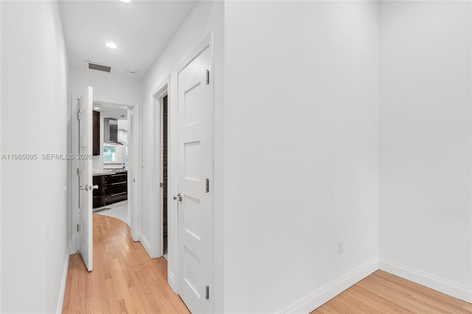 776 Northeast 74th Street Miami, FL 33138 - Photo 17 of 40 a view of a hallway with wooden floor and closet