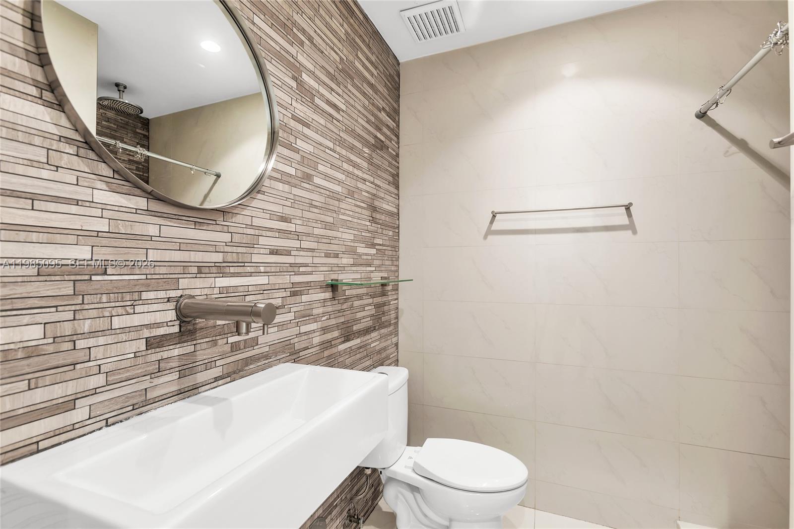 776 Northeast 74th Street Miami, FL 33138 - Photo 18 of 40 a bathroom with a sink and a mirror