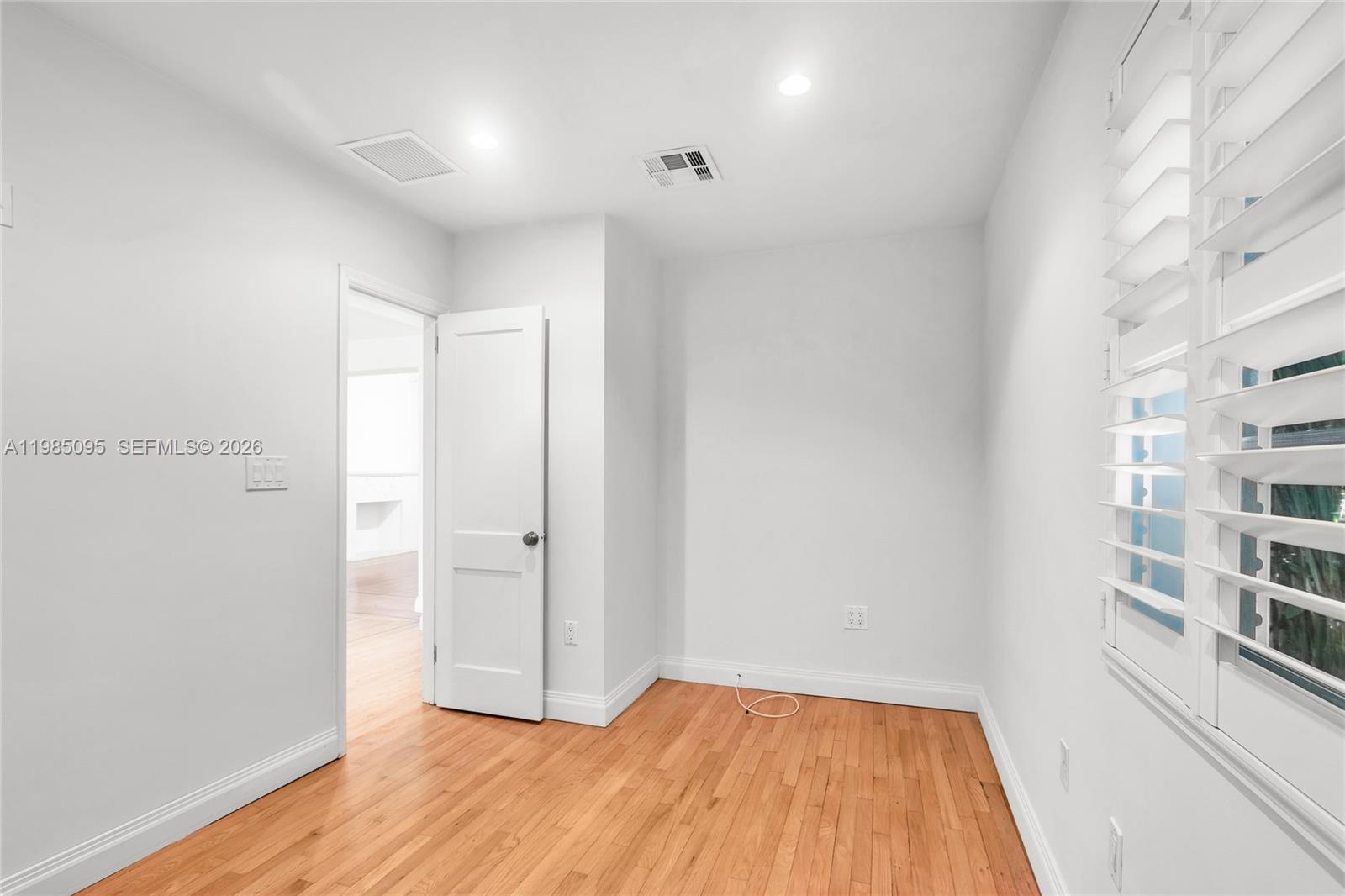 776 Northeast 74th Street Miami, FL 33138 - Photo 20 of 40 a view of a room with wooden floor and closet