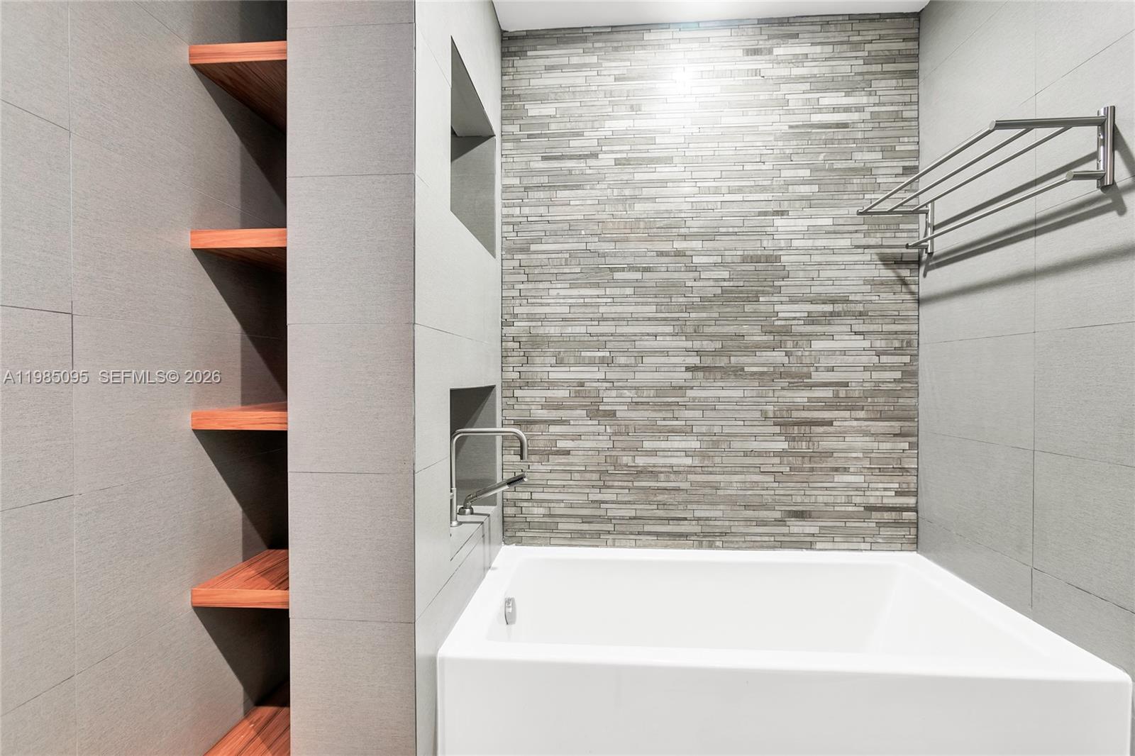 776 Northeast 74th Street Miami, FL 33138 - Photo 21 of 40 a bathroom with bathtub and shower