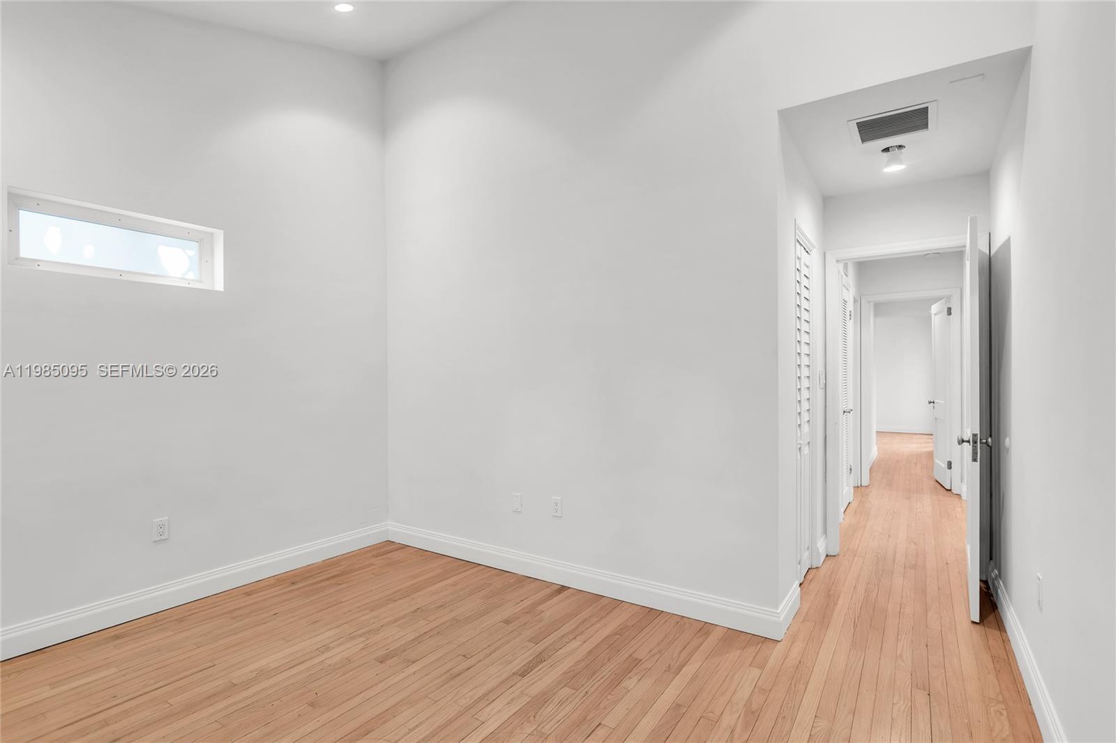 776 Northeast 74th Street Miami, FL 33138 - Photo 24 of 40 a view of a hallway with wooden floor