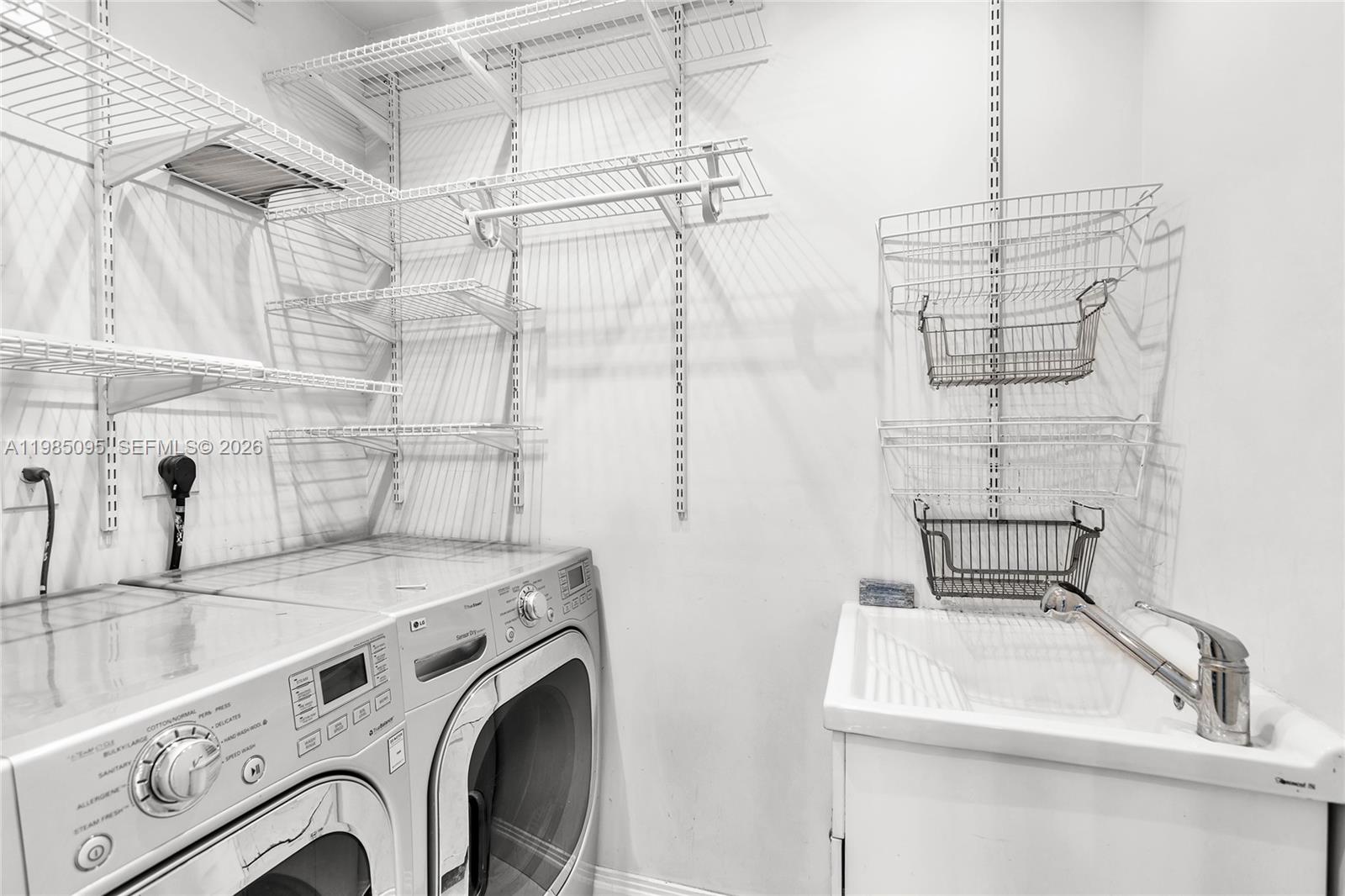 776 Northeast 74th Street Miami, FL 33138 - Photo 29 of 40 a bathroom with a sink and a washing machine
