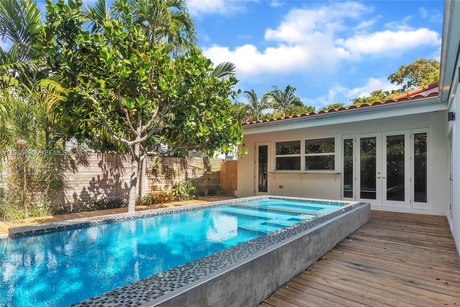 776 Northeast 74th Street Miami, FL 33138 - Photo 32 of 40 a view of a house with pool
