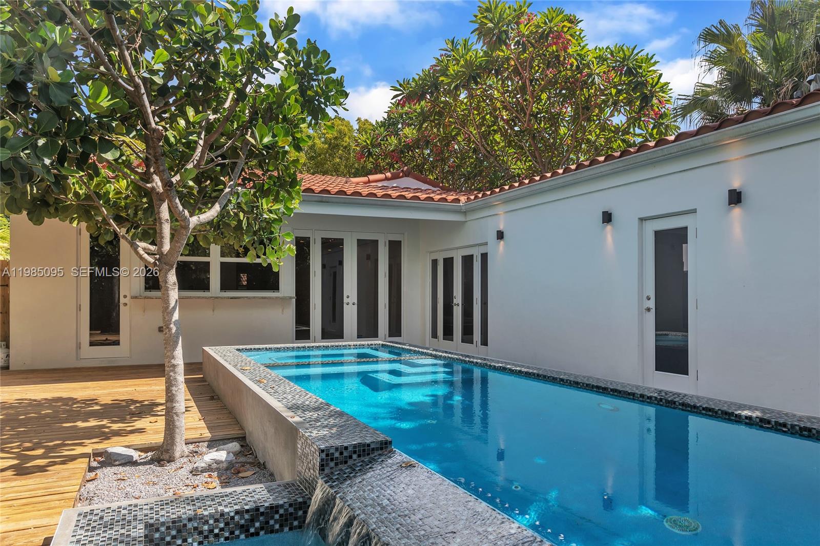 776 Northeast 74th Street Miami, FL 33138 - Photo 33 of 40 a view of house with backyard and furniture