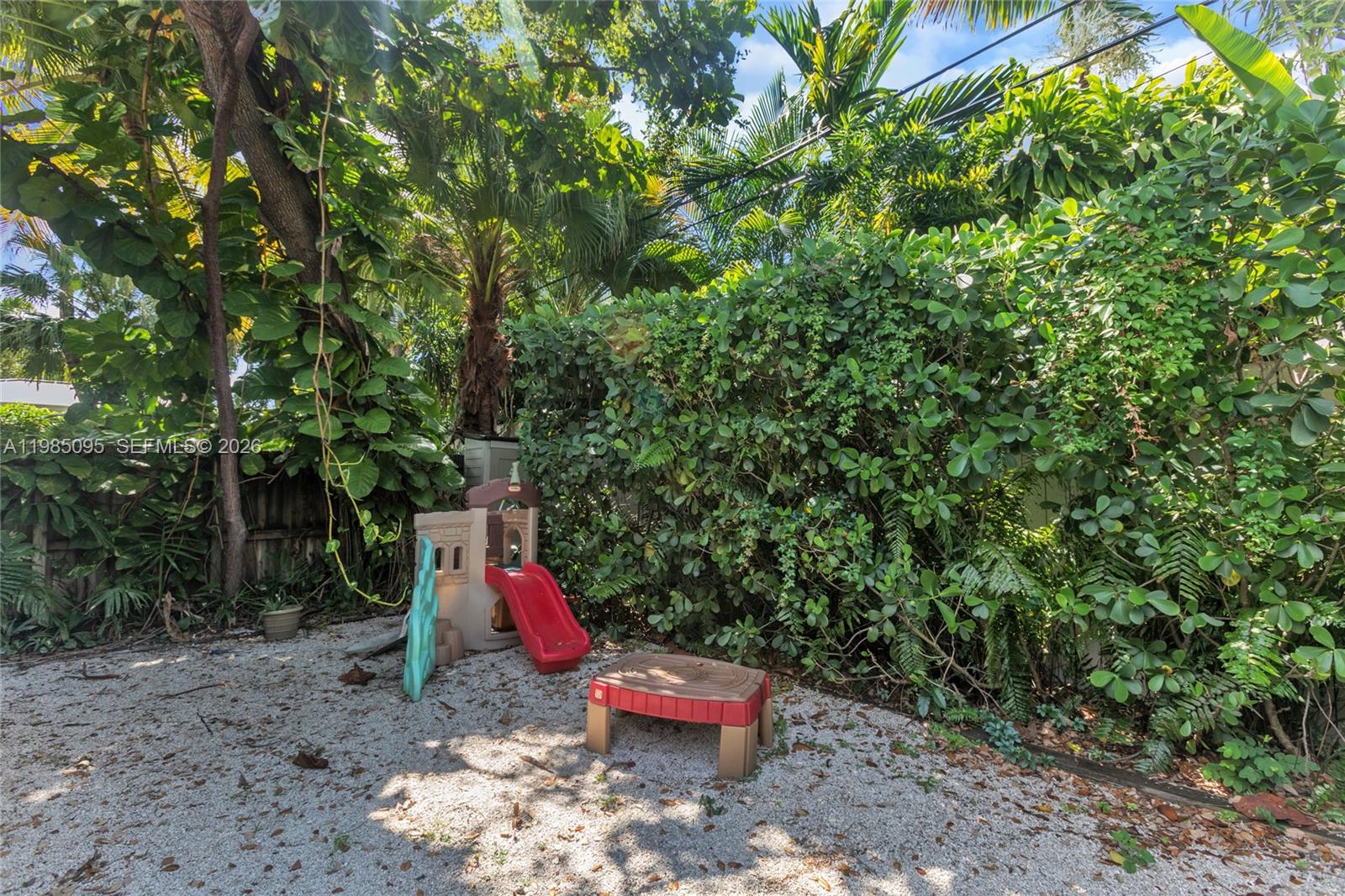 776 Northeast 74th Street Miami, FL 33138 - Photo 35 of 40 a small garden with lots of trees