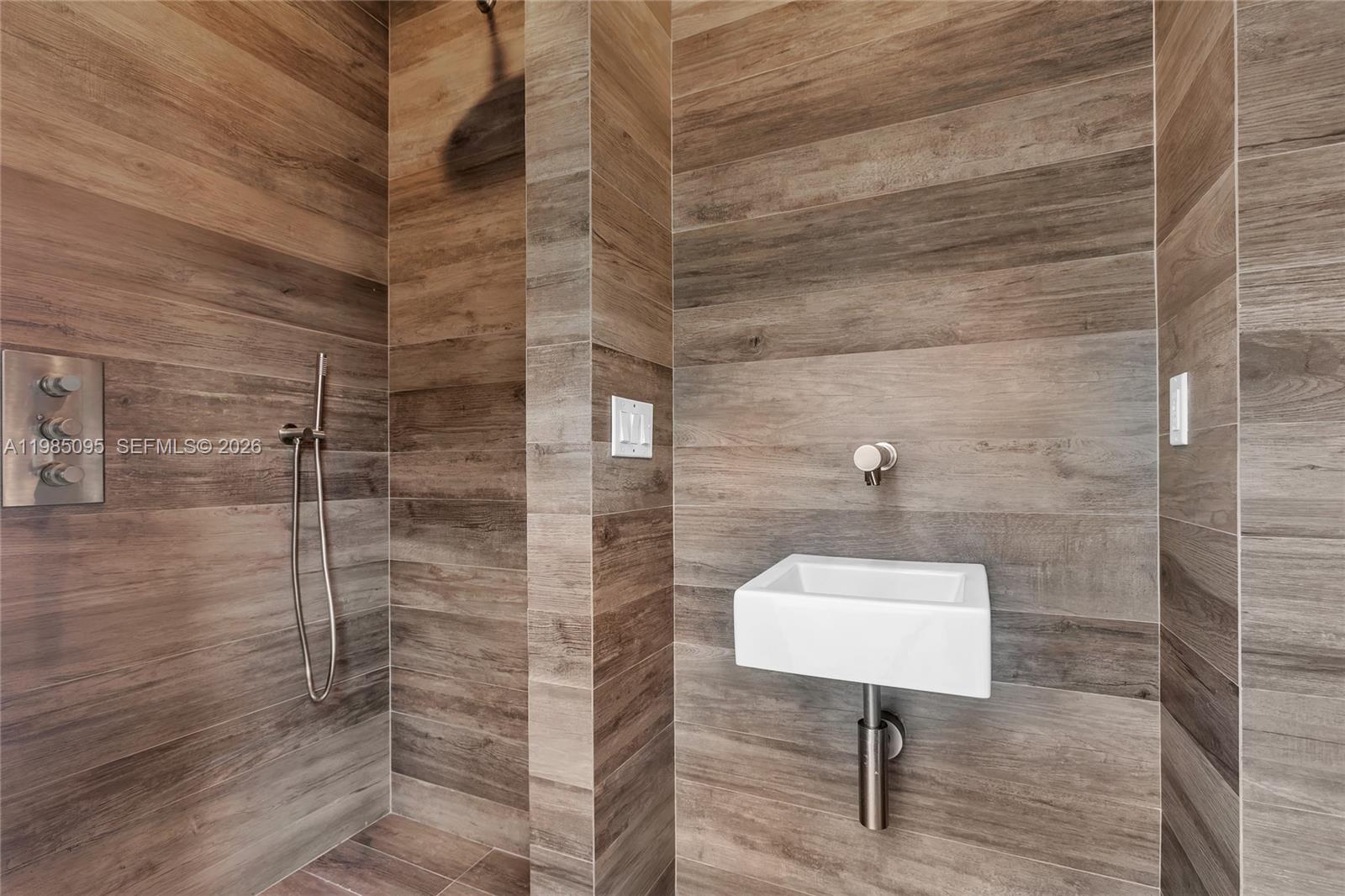776 Northeast 74th Street Miami, FL 33138 - Photo 36 of 40 a bathroom with a toilet a sink and a shower
