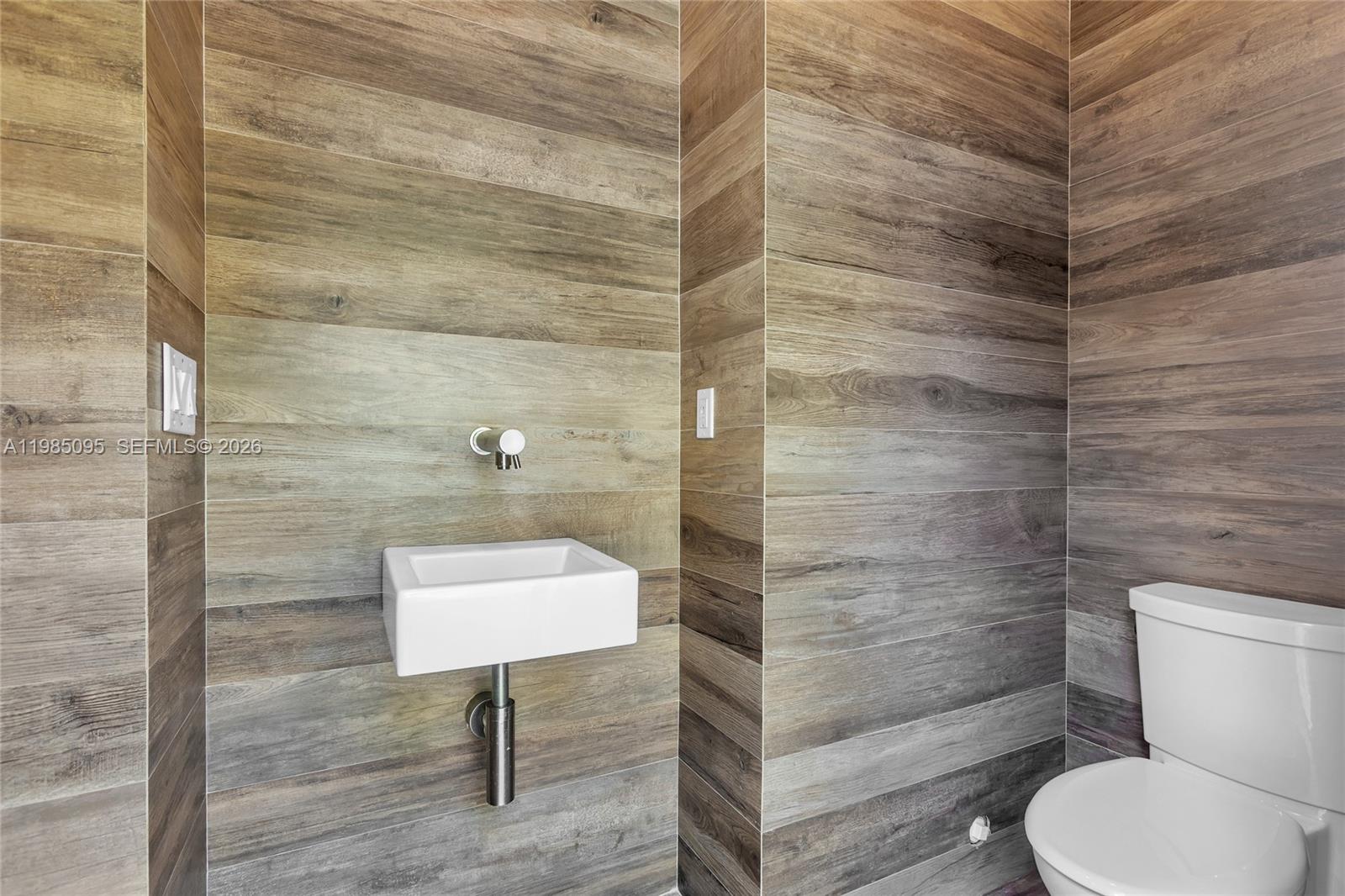 776 Northeast 74th Street Miami, FL 33138 - Photo 37 of 40 a bathroom with a toilet and a shower