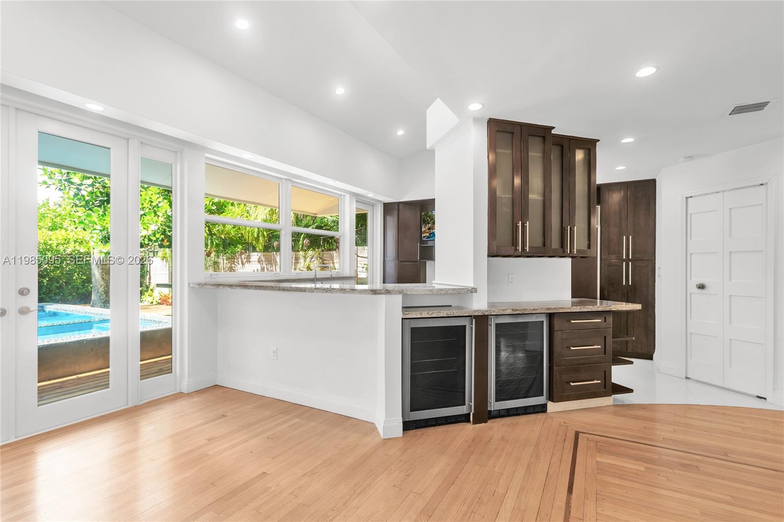 776 Northeast 74th Street Miami, FL 33138 - Photo 7 of 40 a kitchen with stainless steel appliances granite countertop a stove and a sink