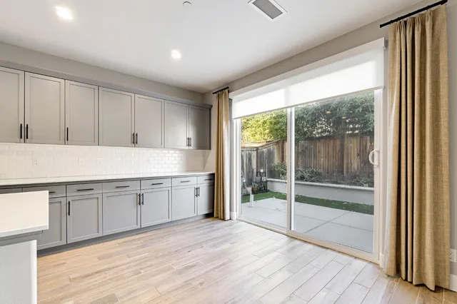 a view of a kitchen with a sink and cabinets