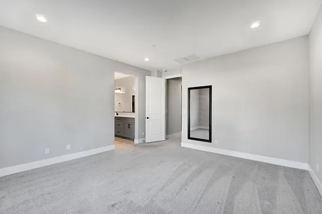 a view of a livingroom with a kitchen
