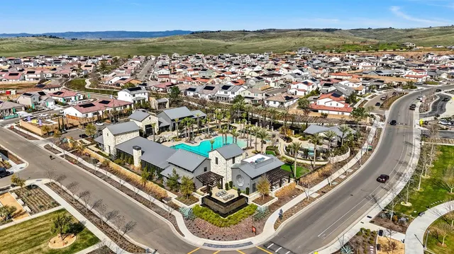 an aerial view of a city with ocean view