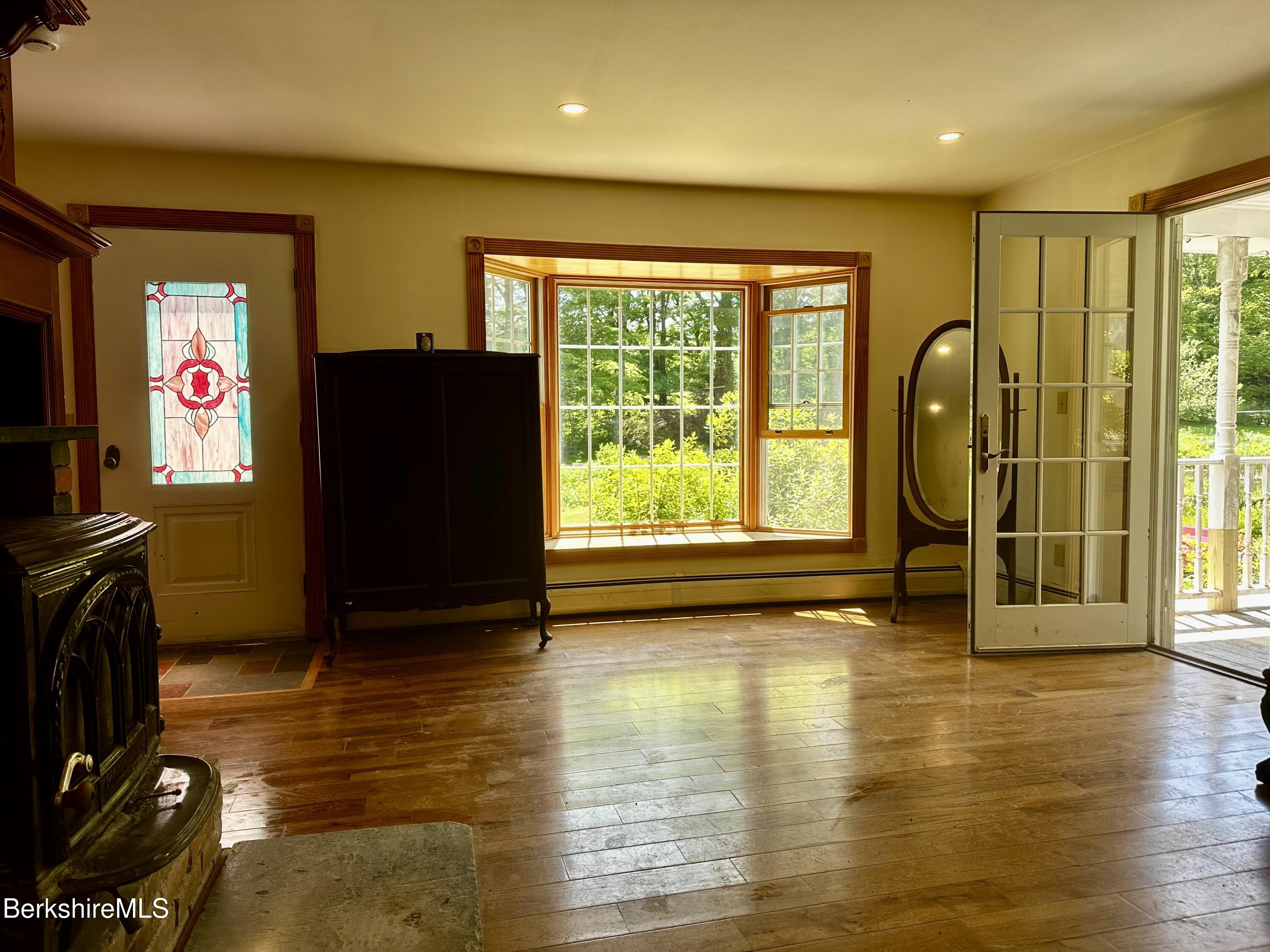 1689 East Windsor Road Windsor, MA 01270 - Photo 20 of 57 a view of a livingroom with furniture water & floor to ceiling window