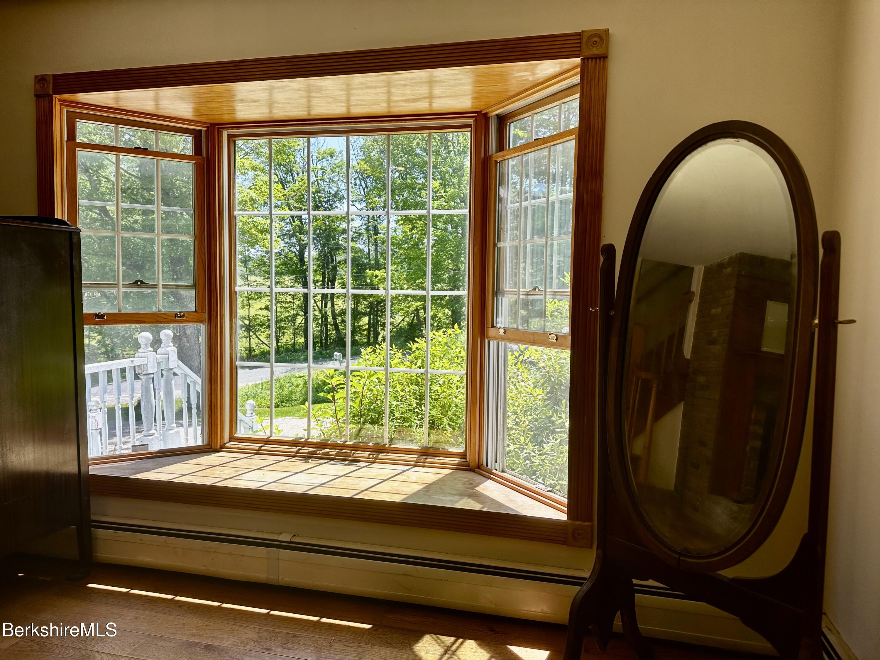 1689 East Windsor Road Windsor, MA 01270 - Photo 25 of 57 a room with a large window and mirror