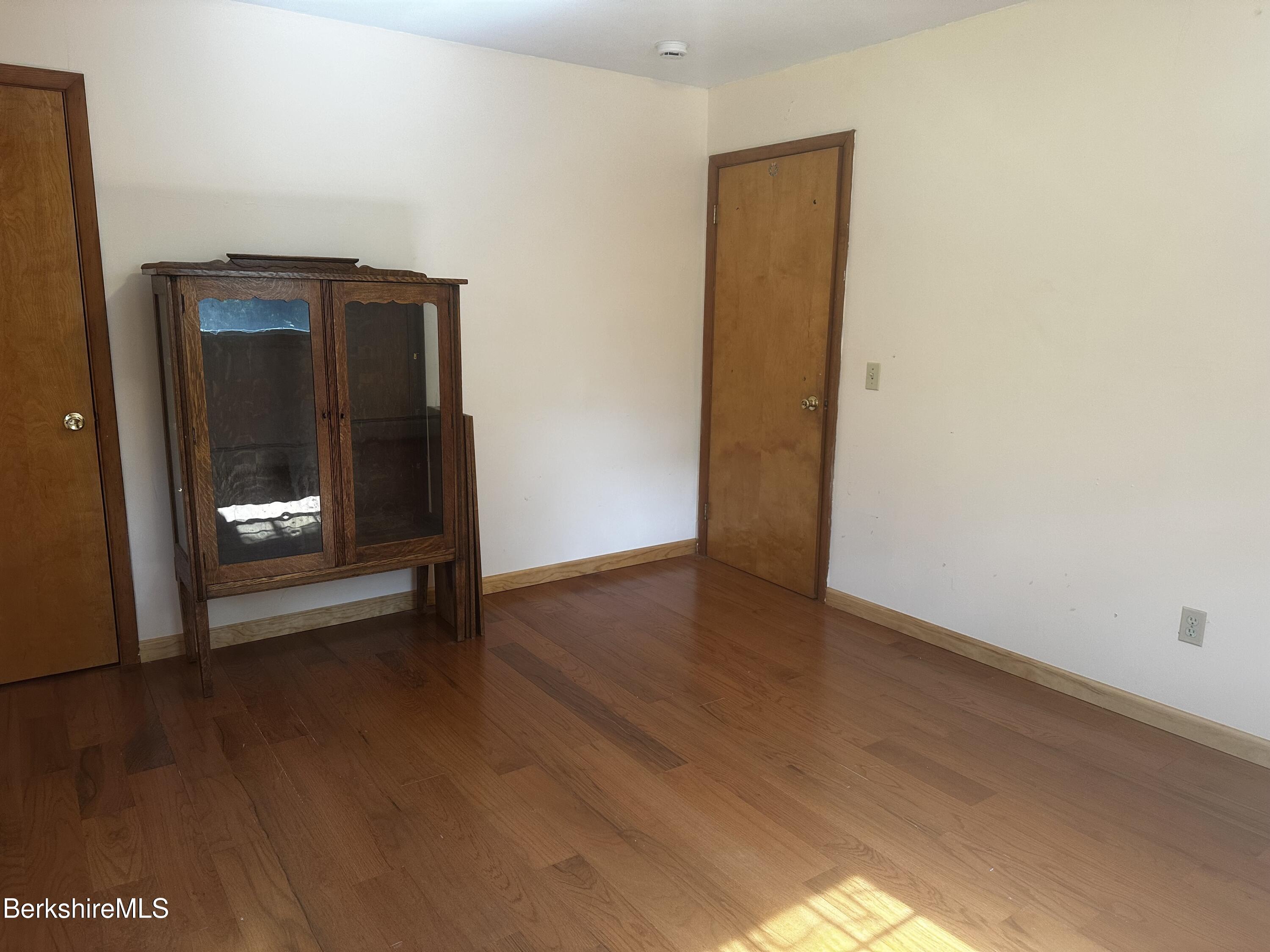 1689 East Windsor Road Windsor, MA 01270 - Photo 39 of 57 a view of an empty room with wooden floor and a window