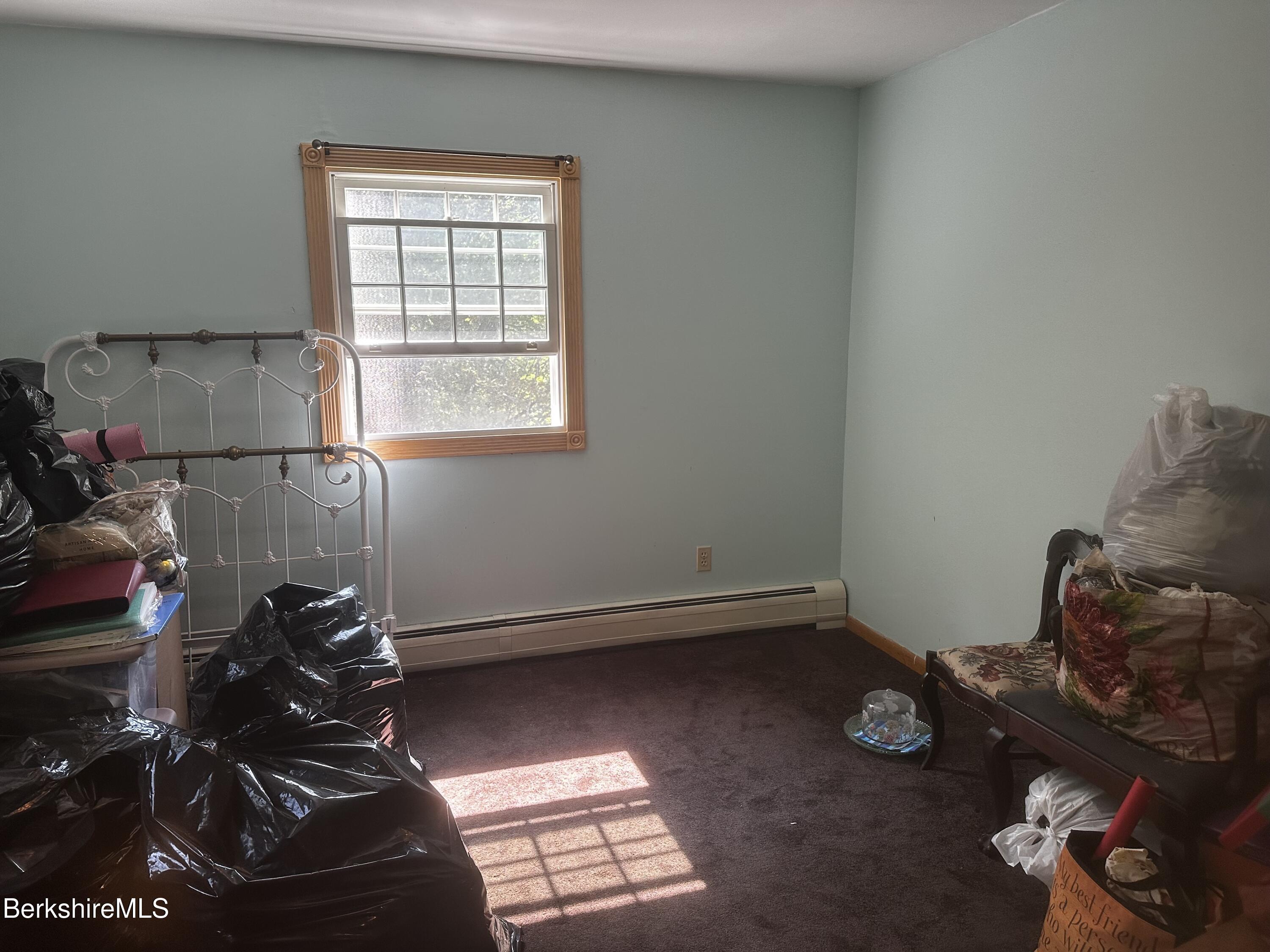 1689 East Windsor Road Windsor, MA 01270 - Photo 44 of 57 a room with furniture and a window