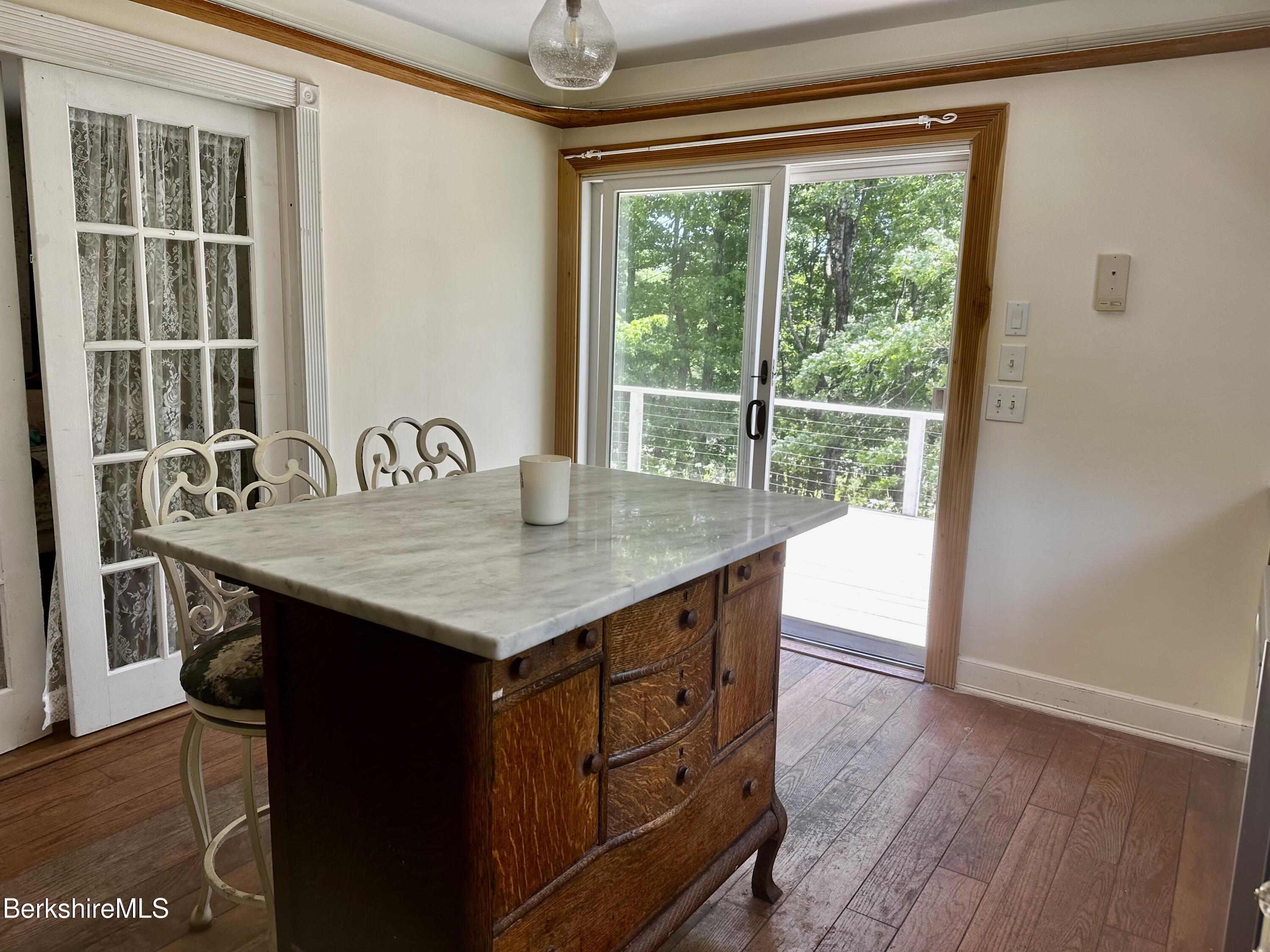 1689 East Windsor Road Windsor, MA 01270 - Photo 6 of 57 a kitchen with a granite countertop sink and wooden floor