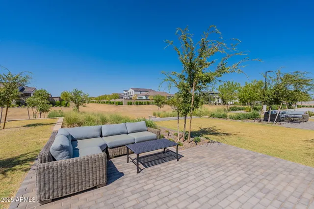 a view of a patio with couches and city view