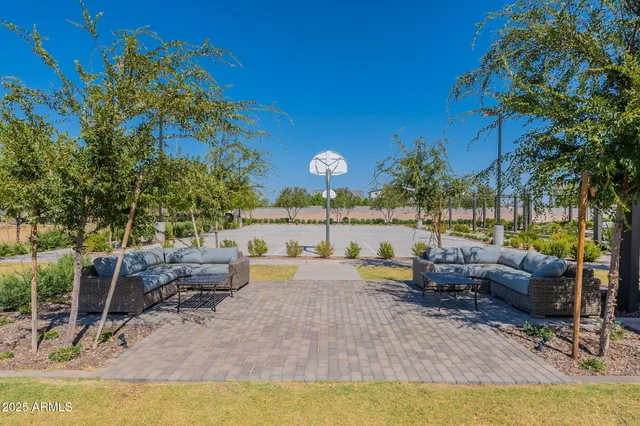 a view of swimming pool with outdoor seating