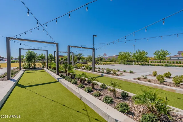 a view of a backyard and swimming pool