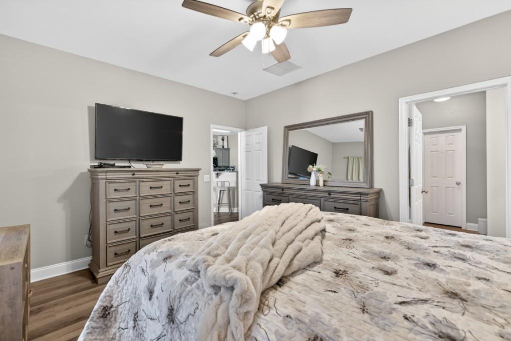 160 Riley Circle Dawsonville, GA 30534 - Photo 18 of 52 a bedroom with a bed and a flat screen tv in it