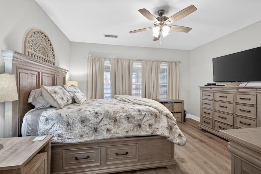 160 Riley Circle Dawsonville, GA 30534 - Photo 19 of 52 a bedroom with a bed and a flat screen tv