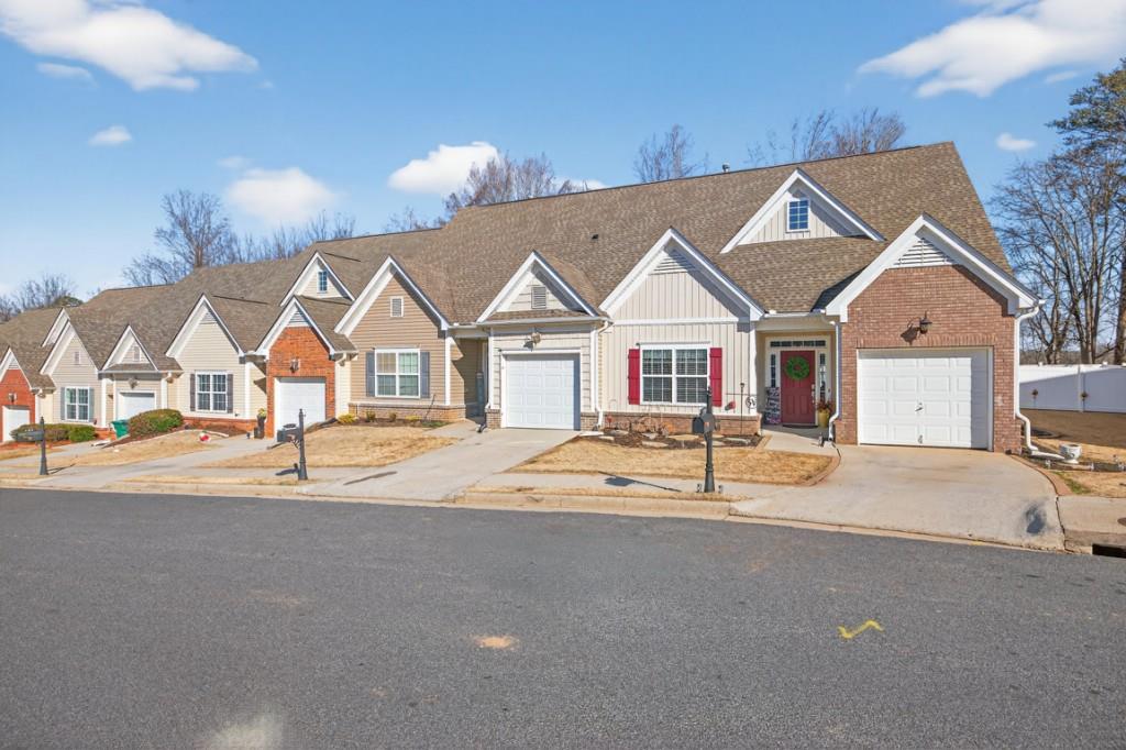 160 Riley Circle Dawsonville, GA 30534 - Photo 2 of 52 a house with trees in front of it