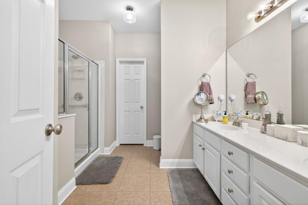 160 Riley Circle Dawsonville, GA 30534 - Photo 21 of 52 a spacious bathroom with a double vanity sink mirror and