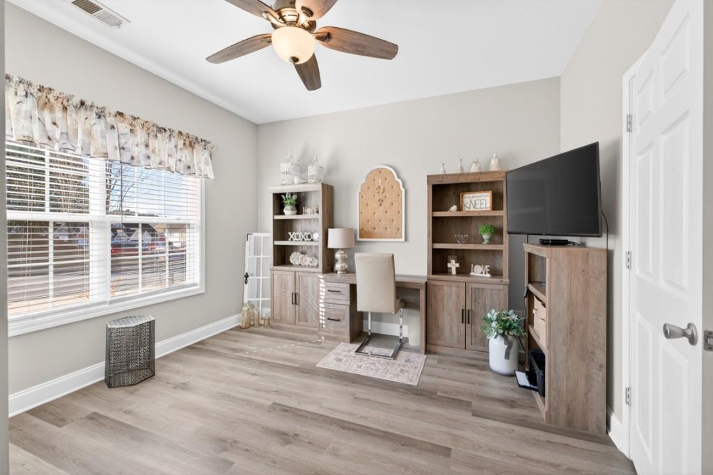 160 Riley Circle Dawsonville, GA 30534 - Photo 23 of 52 a view of a livingroom with furniture and a flat screen tv