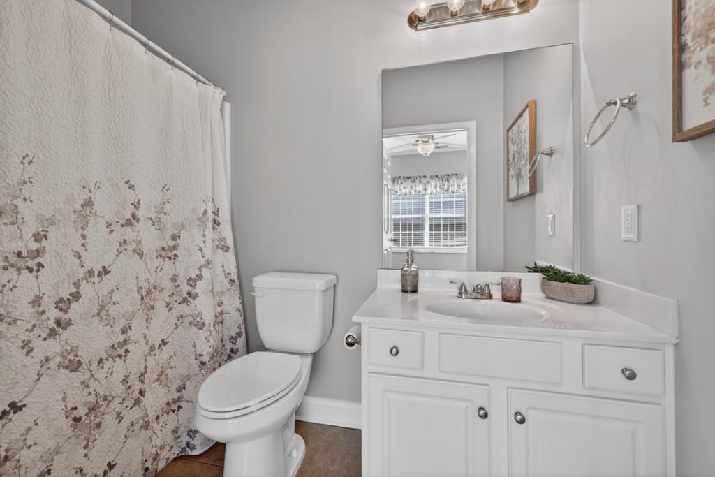 160 Riley Circle Dawsonville, GA 30534 - Photo 25 of 52 a bathroom with a toilet sink and mirror