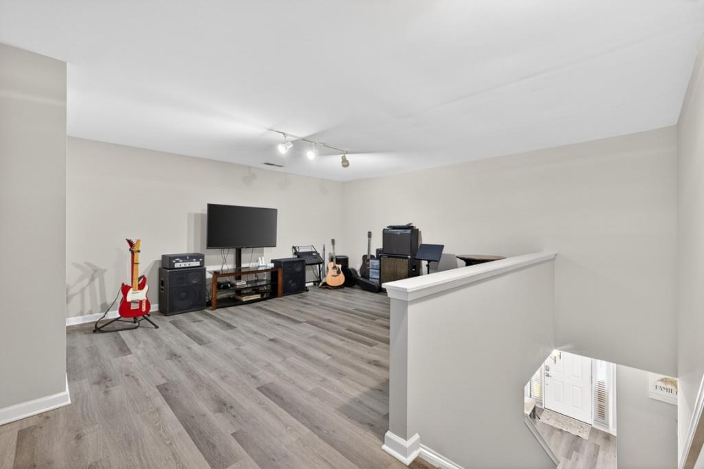 160 Riley Circle Dawsonville, GA 30534 - Photo 27 of 52 a view of a livingroom with furniture and a flat screen tv