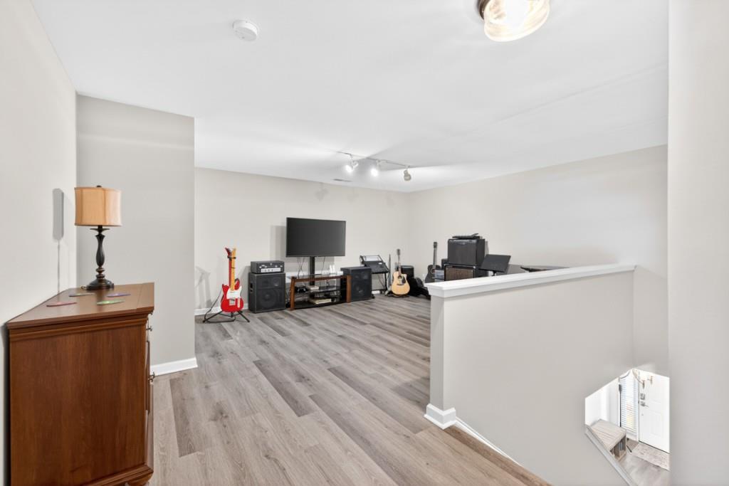 160 Riley Circle Dawsonville, GA 30534 - Photo 29 of 52 a living room with furniture and a flat screen tv