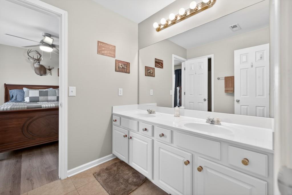 160 Riley Circle Dawsonville, GA 30534 - Photo 33 of 52 a en suite bathroom with a double vanity sink and a mirror