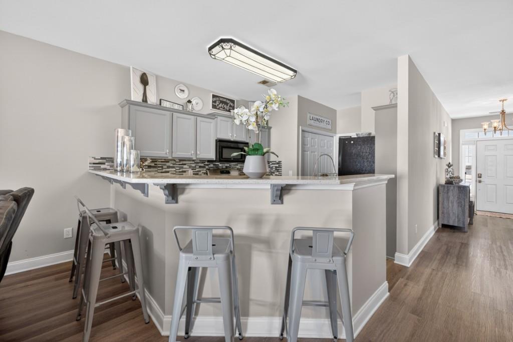 160 Riley Circle Dawsonville, GA 30534 - Photo 10 of 52 a kitchen with cabinets and wooden floor
