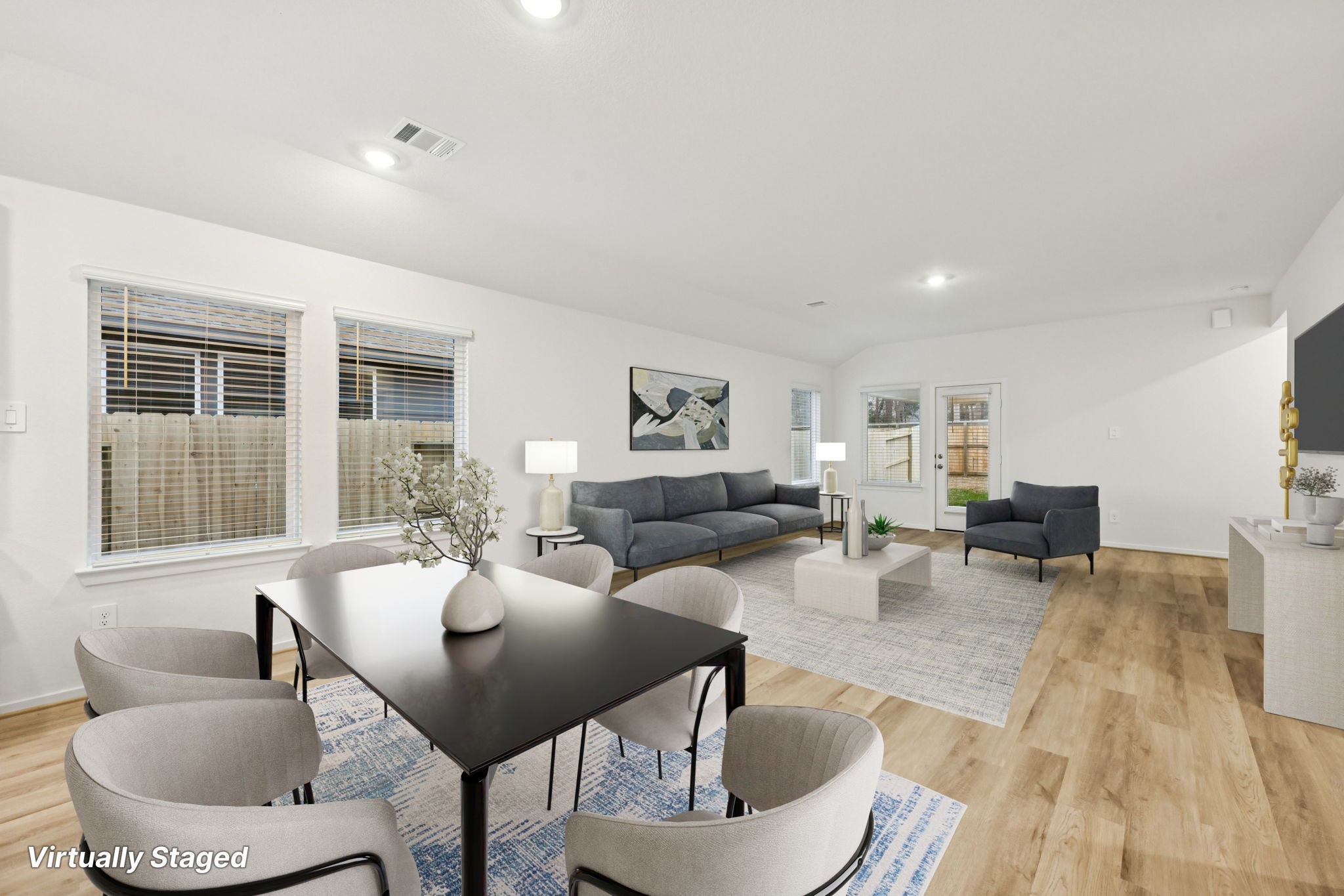 16213 Parish Pointe Court Conroe, TX 77302 - Photo 11 of 32 a living room with furniture and a table