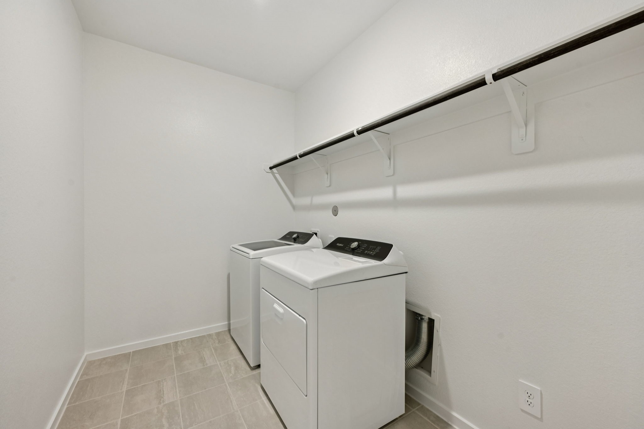 16213 Parish Pointe Court Conroe, TX 77302 - Photo 18 of 32 a utility room with dryer and washer