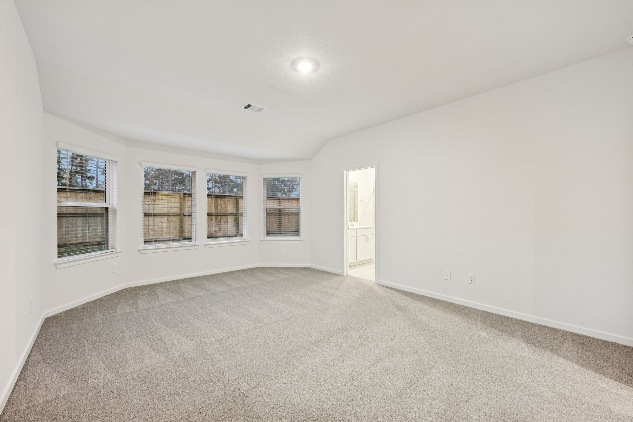 16213 Parish Pointe Court Conroe, TX 77302 - Photo 19 of 32 an empty room with windows