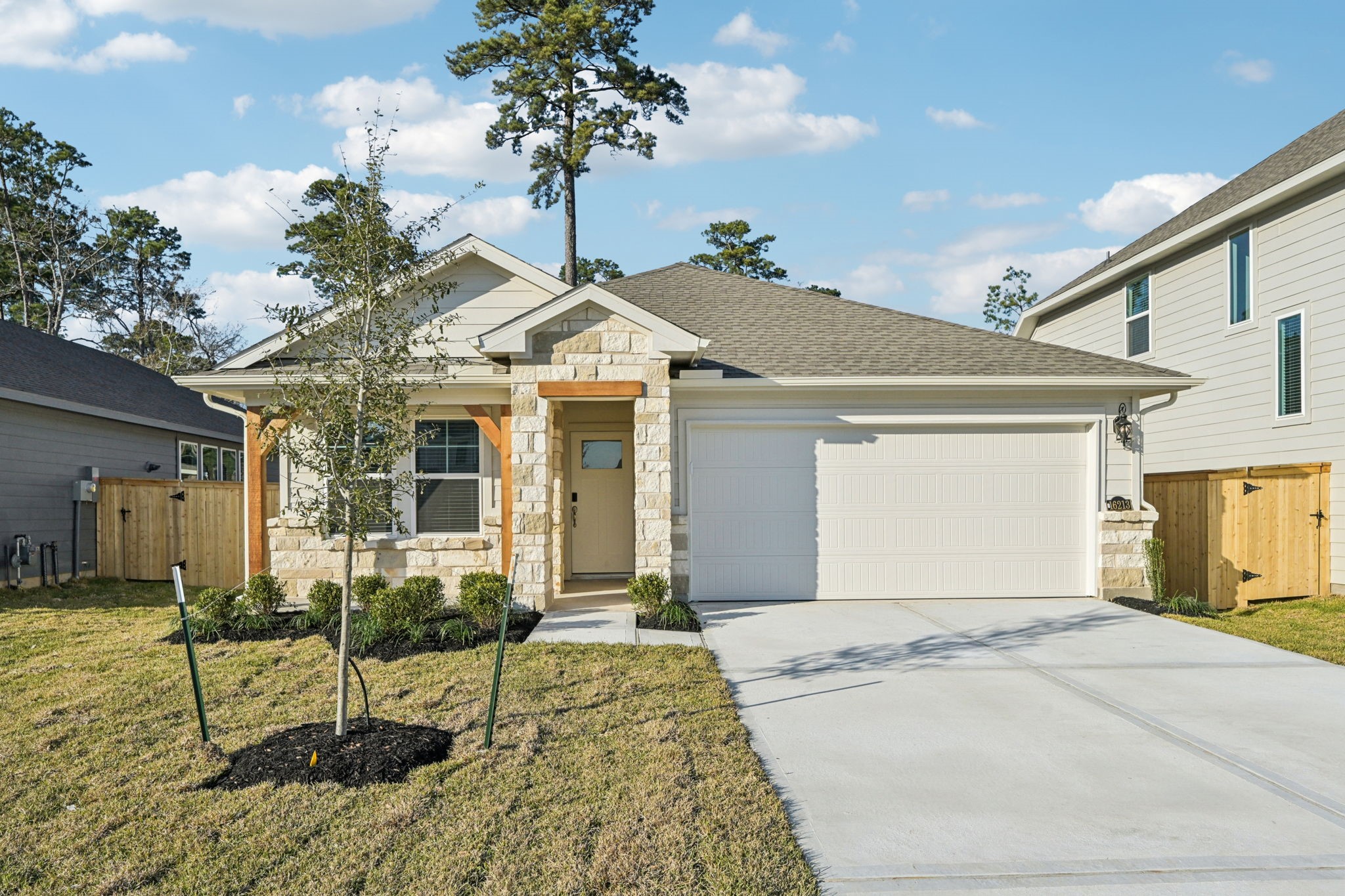 16213 Parish Pointe Court Conroe, TX 77302 - Photo 2 of 32 a front view of a house with garden