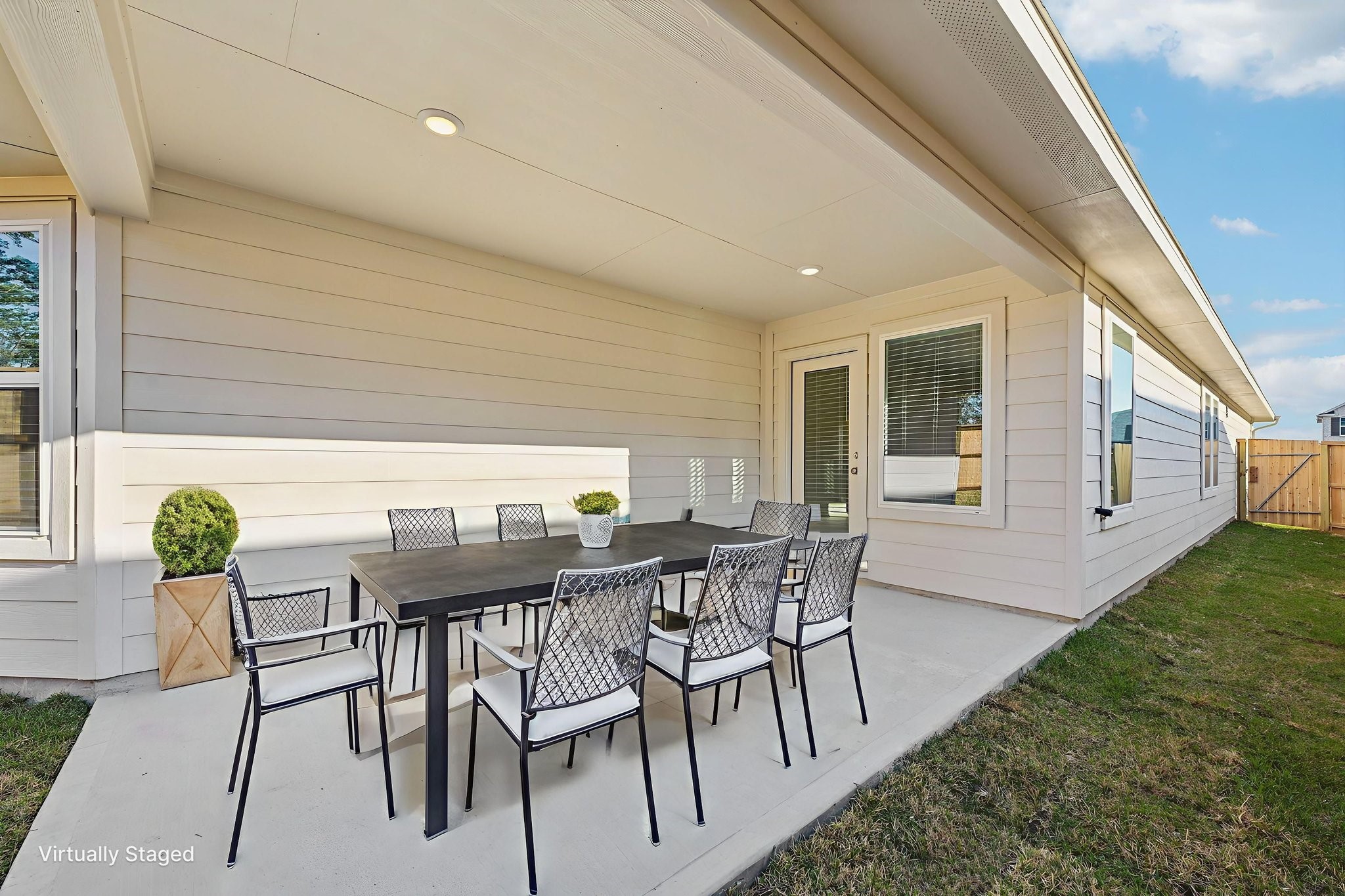 16213 Parish Pointe Court Conroe, TX 77302 - Photo 29 of 32 a view of an outdoor dining space with furniture