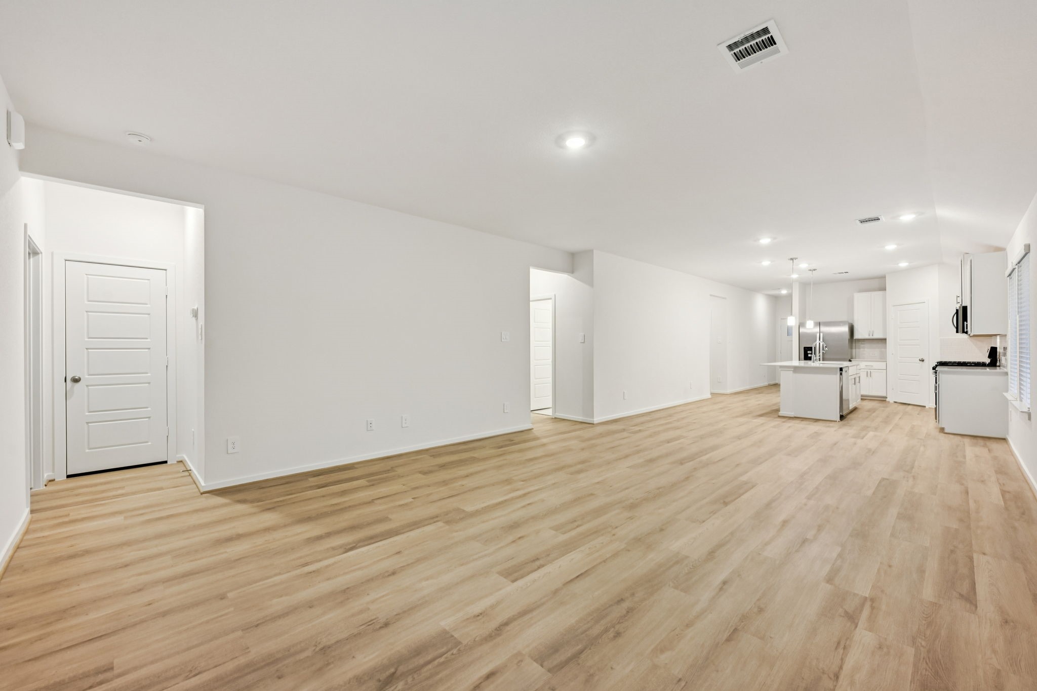 16213 Parish Pointe Court Conroe, TX 77302 - Photo 5 of 32 a view of a livingroom with a kitchen