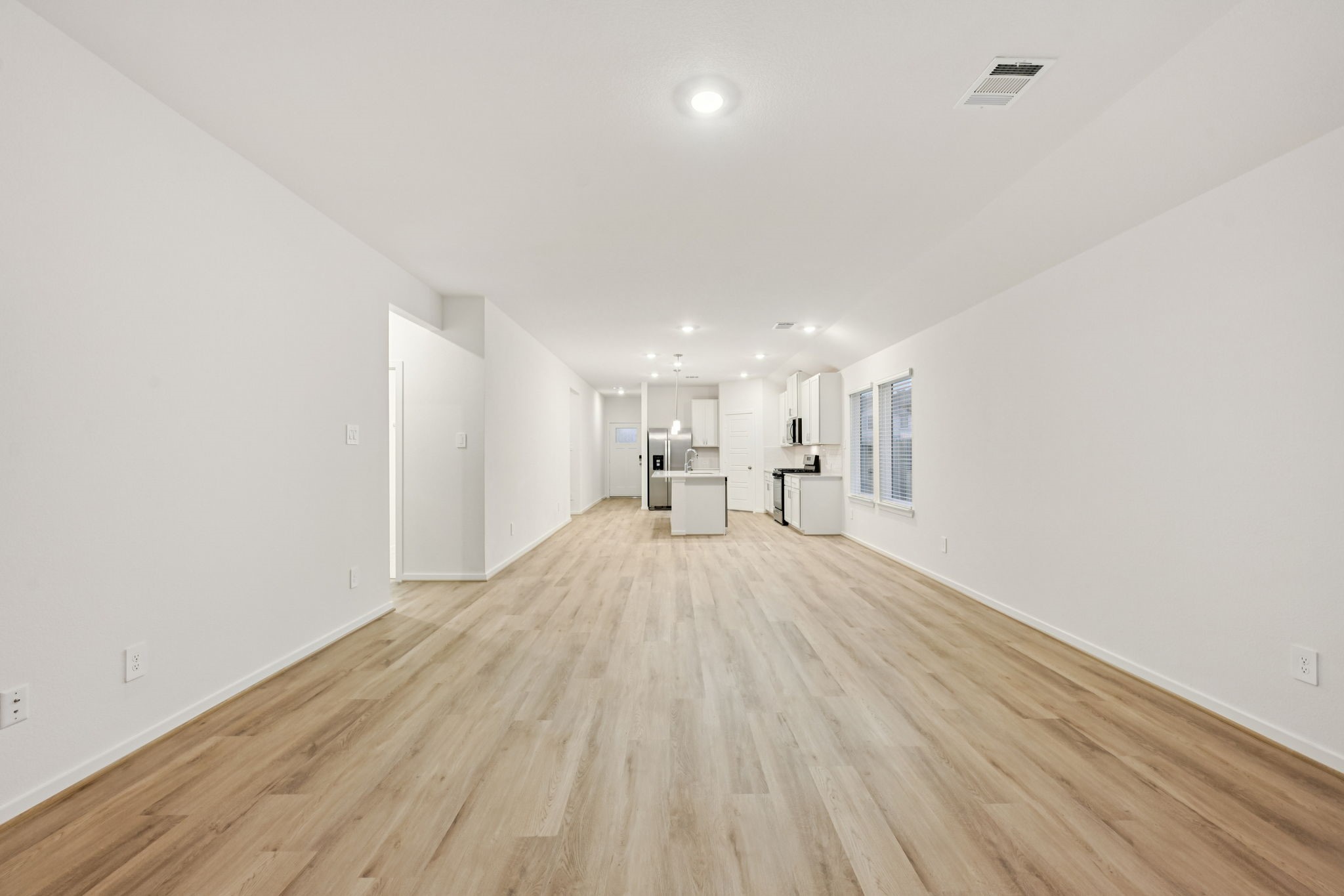 16213 Parish Pointe Court Conroe, TX 77302 - Photo 6 of 32 a view of empty room with wooden floor