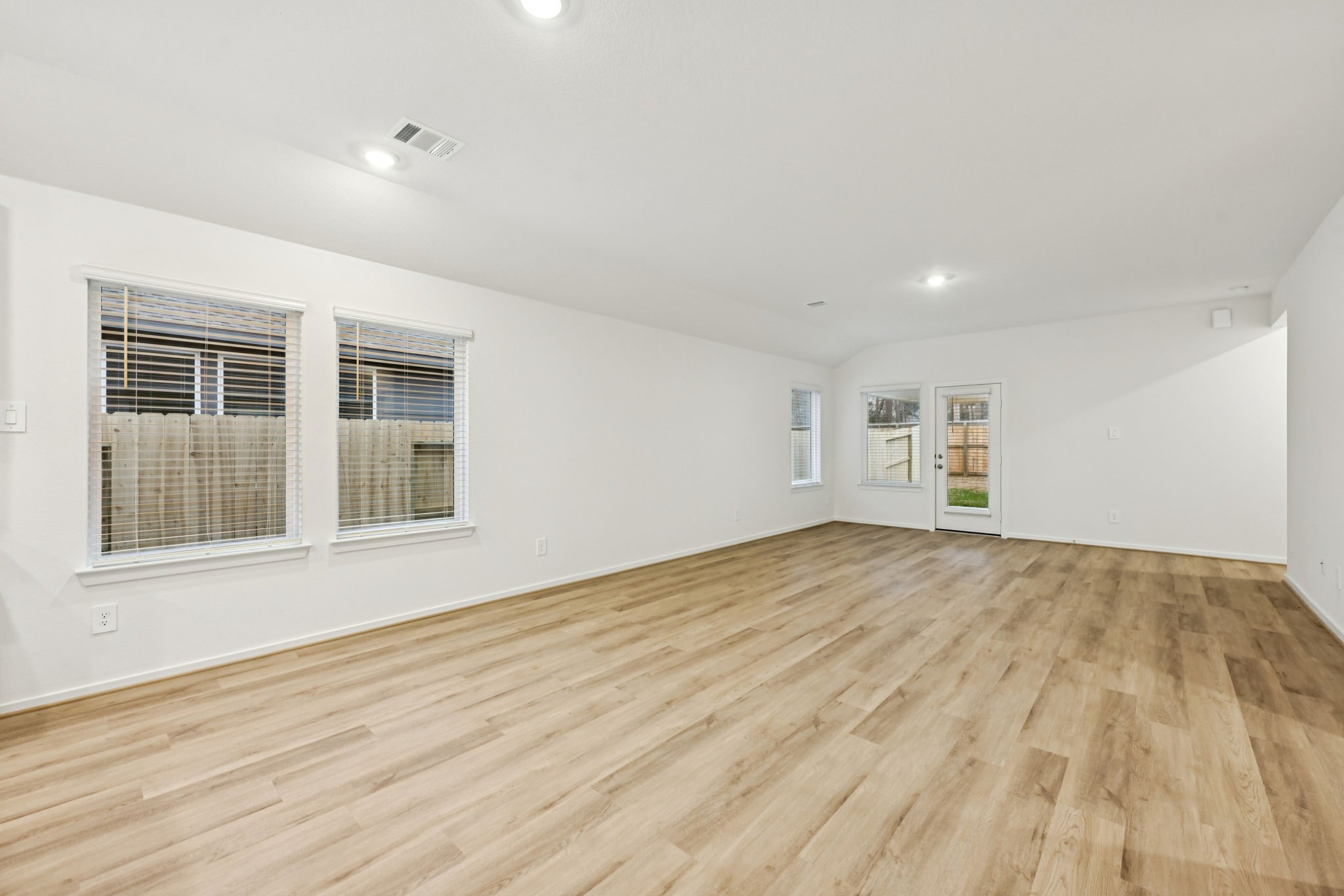 16213 Parish Pointe Court Conroe, TX 77302 - Photo 10 of 32 a view of empty room with wooden floor and fan