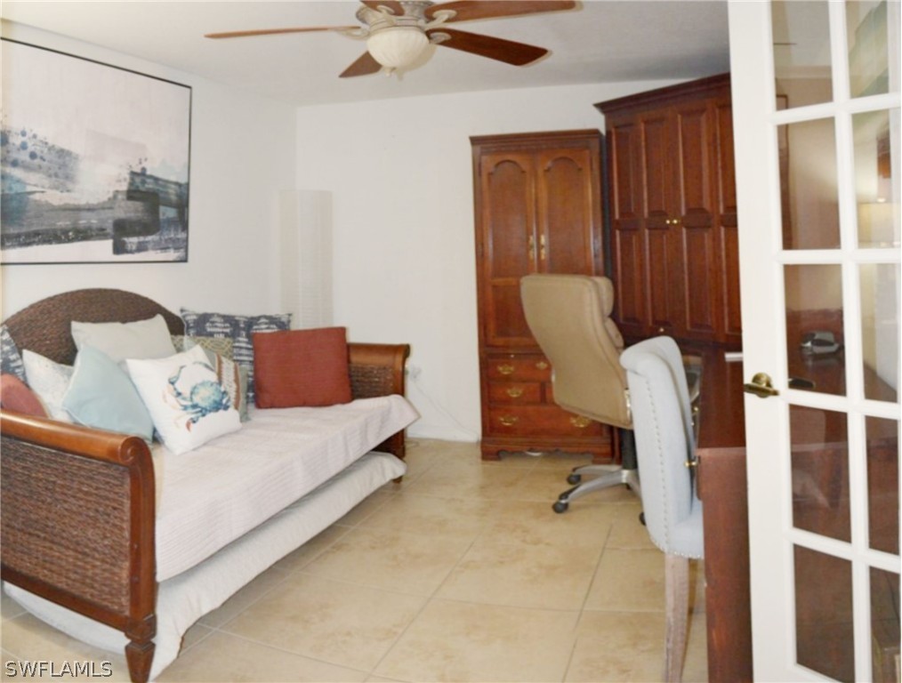 20121 Estero Gardens Circle, Unit 101 Estero, FL 33928 - Photo 14 of 24 a living room with furniture