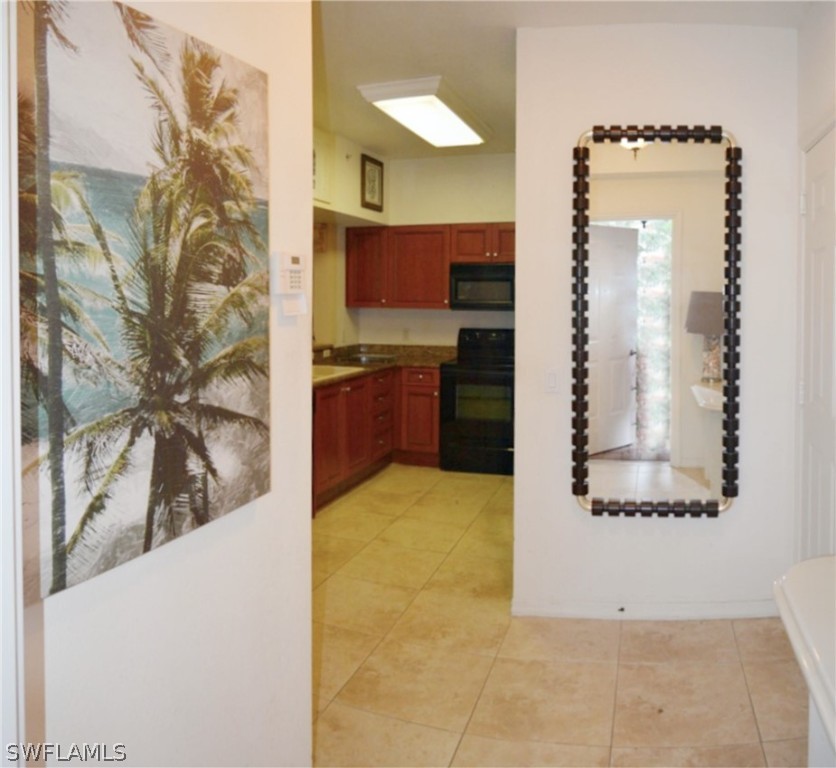 20121 Estero Gardens Circle, Unit 101 Estero, FL 33928 - Photo 19 of 24 a view of a kitchen