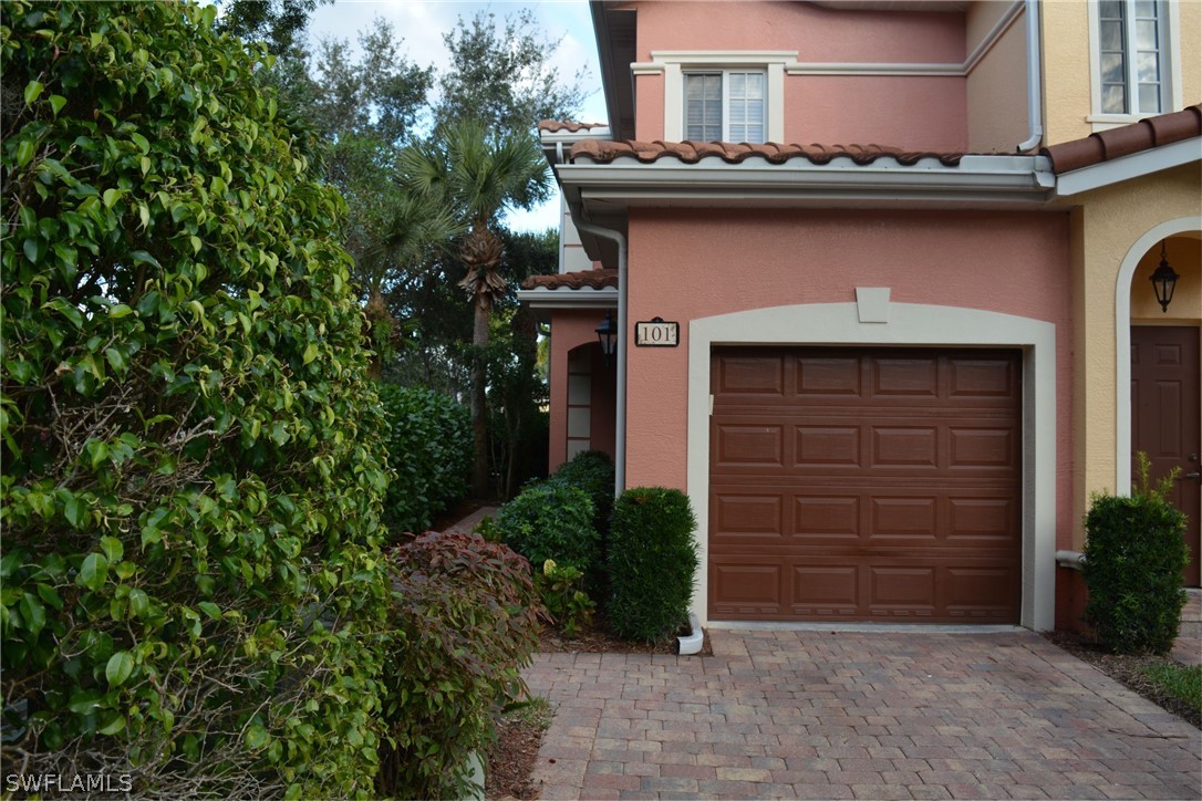20121 Estero Gardens Circle, Unit 101 Estero, FL 33928 - Photo 20 of 24 a house view with a outdoor space