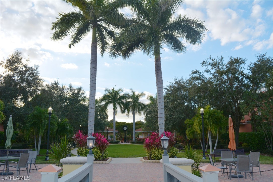 20121 Estero Gardens Circle, Unit 101 Estero, FL 33928 - Photo 24 of 24 a view of a backyard with palm trees