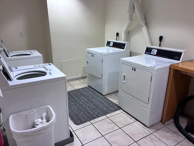a view of workspace with window and cabinet